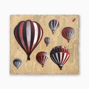 Oeuvre de Jef Aérosol, street artiste, représentant des montgolfières de couleur rouge et noir dans le ciel. Street Art Paris